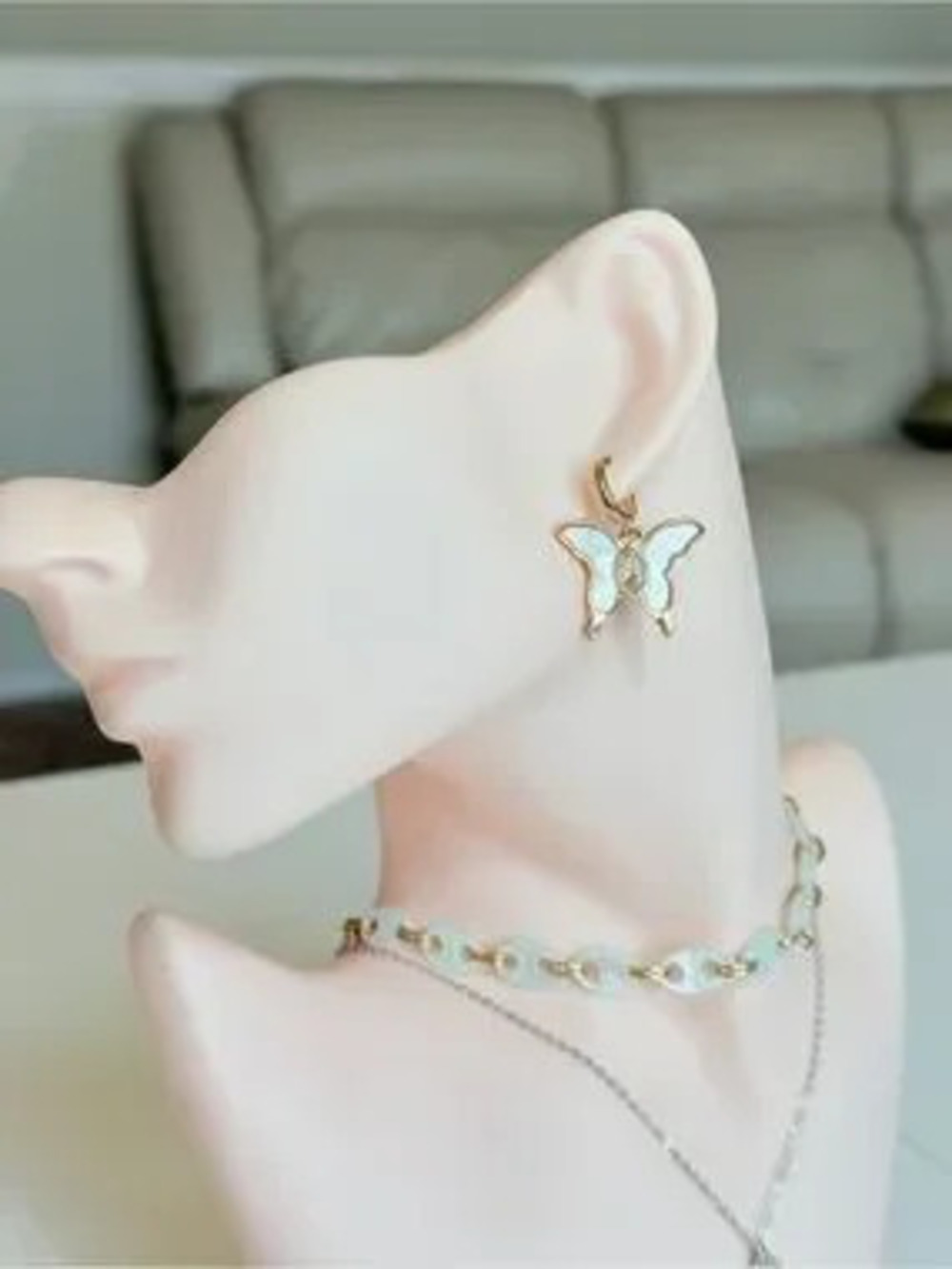 Gold Butterfly Drop Earrings in White Enamel